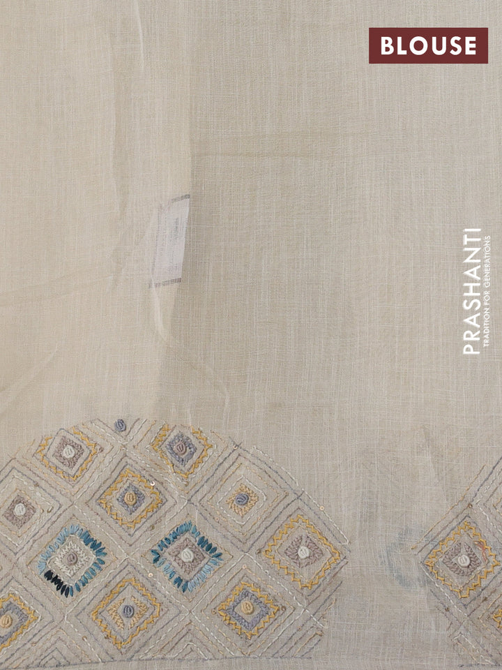 Tissue linen cotton saree cream and sandal with embroidery buttas and embroidery pallu