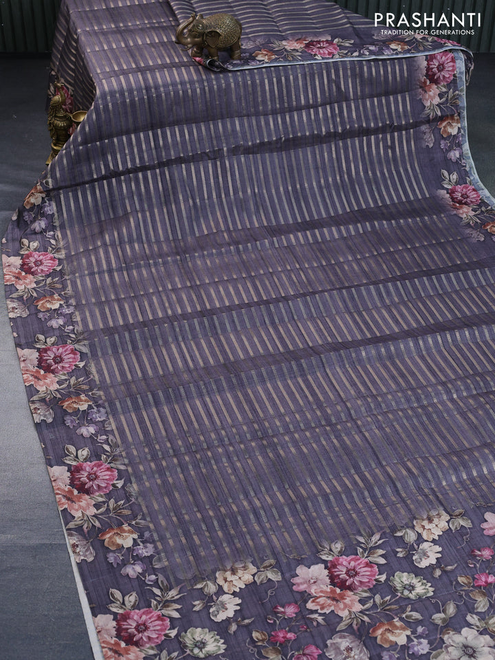 Semi tussar saree grey shade with allover zari woven stripes pattern and floral printed border