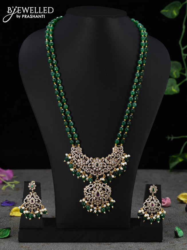 Beaded double layer green necklace with kemp & cz stones and beades hanging in victorian finish
