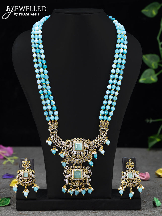 Beaded triple layer ice blue necklace with mint green & cz stones and beades hanging in victorian finish