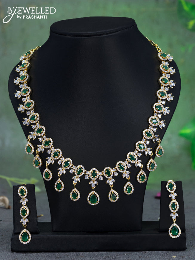 Zircon necklace with emerald and cz stones in gold finish