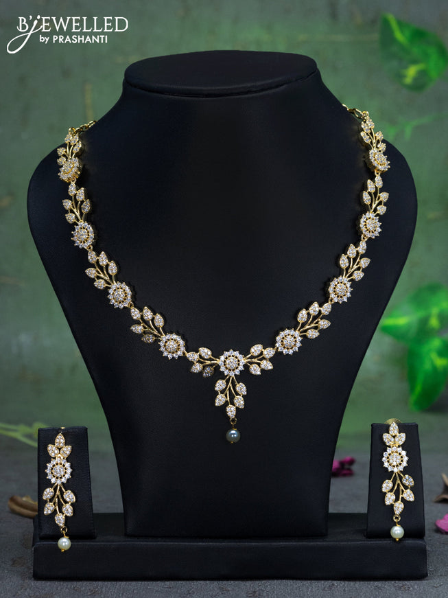 Zircon necklace floral design with cz stones and pearl hangings in gold finish