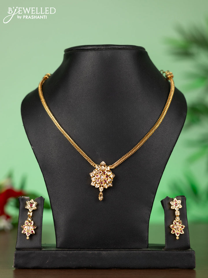 Attigai impon necklace with floral pendant in red,green and white stones