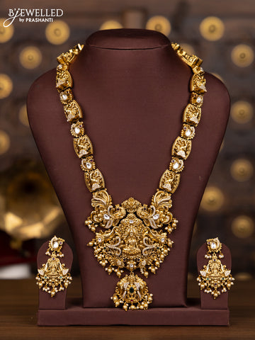 Antique haaram with lakshmi and elephant pendant design in kundan stones and pearl hanging