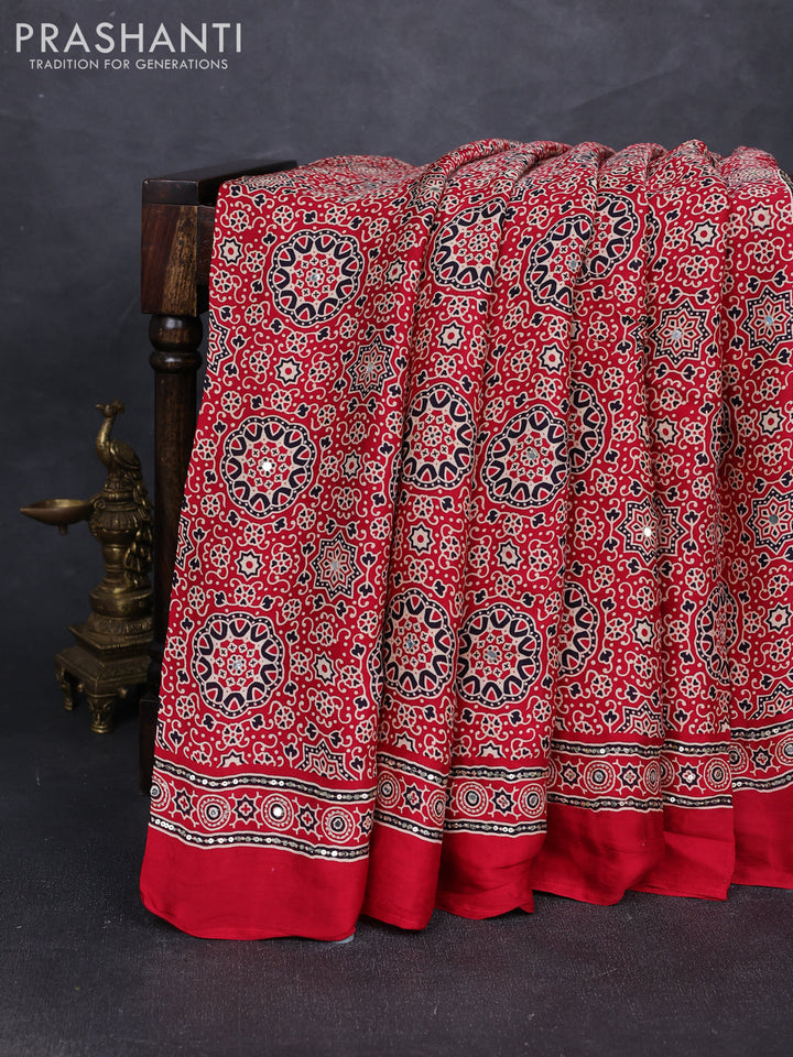 Modal silk saree tomato red with allover ajrakh prints and mirror & sequin embroidery pallu