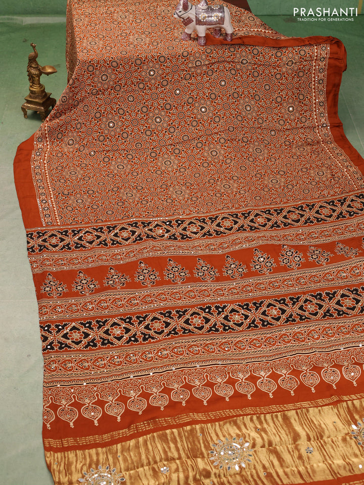 Modal silk saree dark mustard with allover ajrakh prints and mirror & sequin embroidery pallu