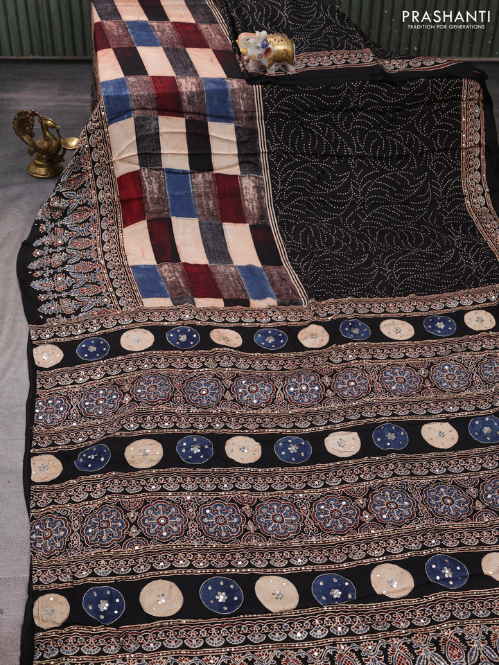 Modal silk saree black with allover geometric prints and ajrakh prints mirror & sequin embroidery pallu
