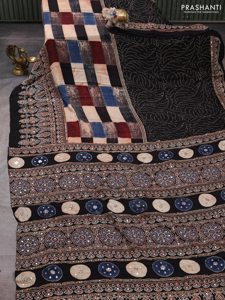Modal silk saree black with allover geometric prints and ajrakh prints mirror & sequin embroidery pallu