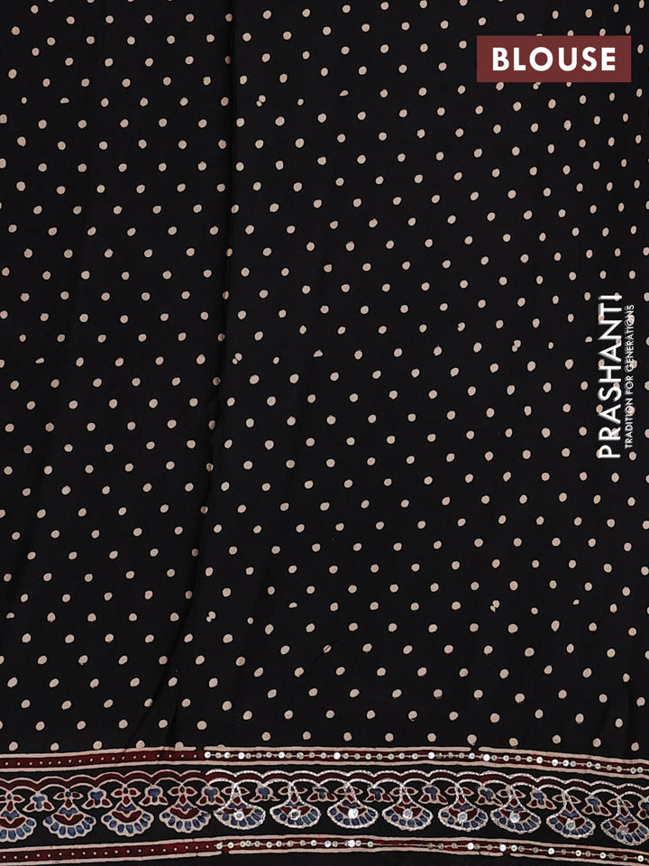 Modal silk saree black with allover geometric prints and ajrakh prints mirror & sequin embroidery pallu