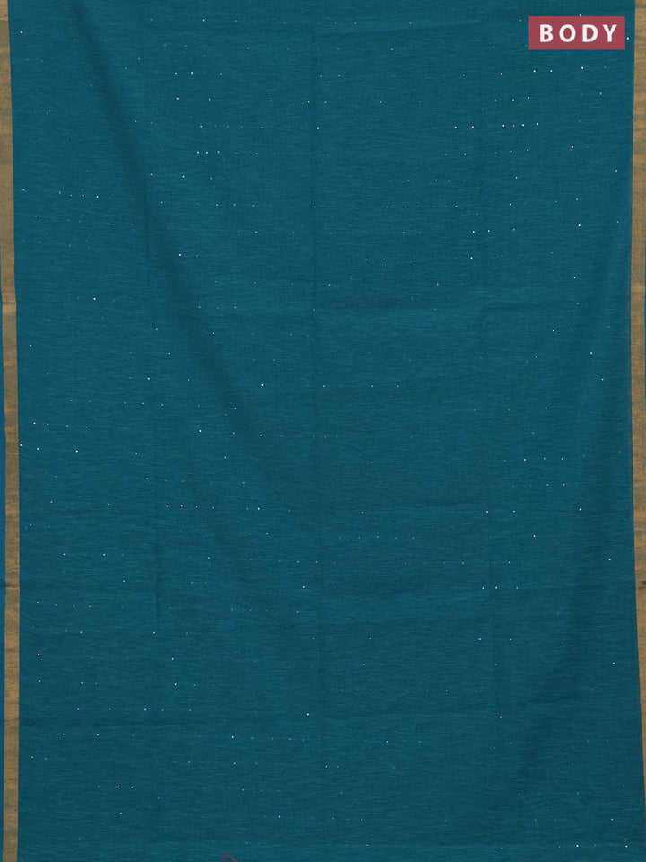 Jute silk saree teal blue with allover sequin work and zari woven border