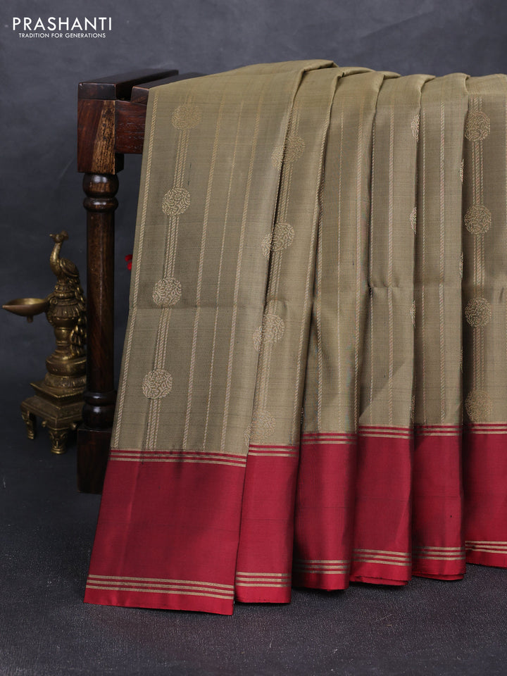 Pure soft silk saree olive green and red with allover zari stripes & buttas and rettapet zari woven border