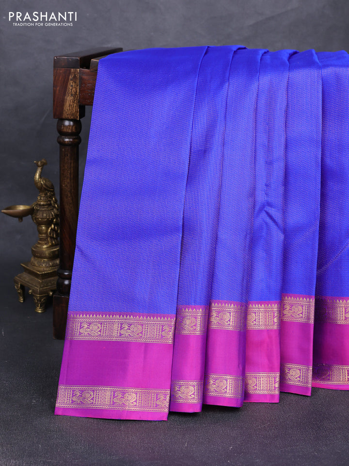 Pure soft silk saree royal blue and purple with allover zari woven brocade weaves and rettapet zari woven border