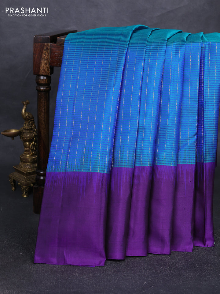 Pure soft silk saree dual shade of teal blue and deep violet with allover silver zari stripe pattern and long silver zari woven butta border