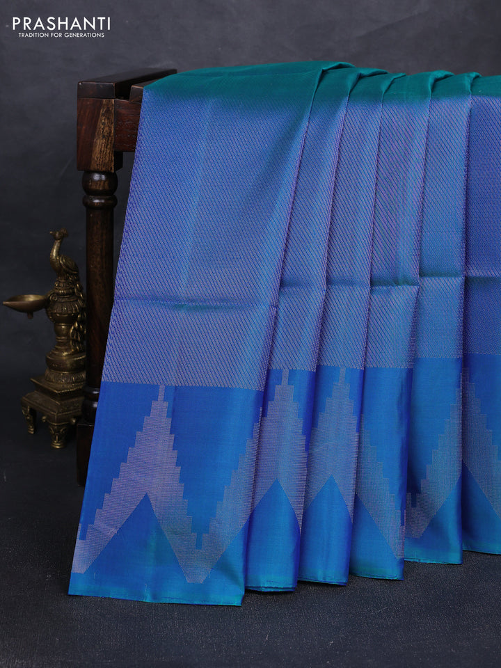 Pure soft silk saree dual shade of bluish green with allover silver zari woven brocade weaves and temple design silver zari woven border