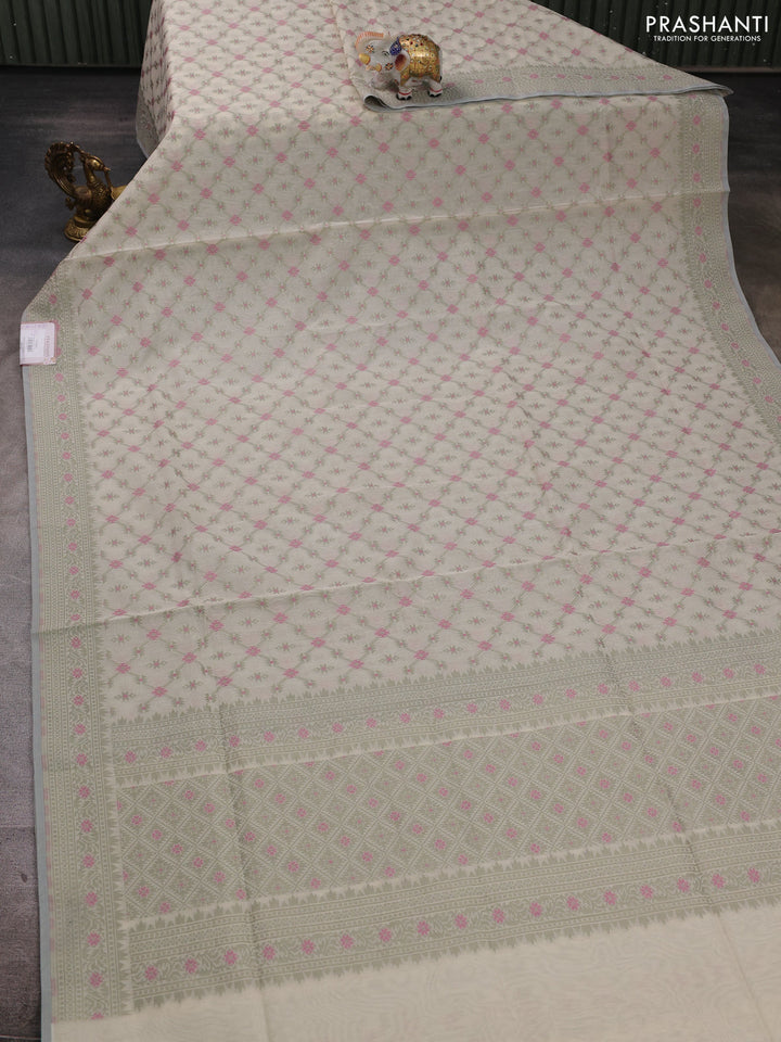 Banarasi cotton saree cream and pastel green with allover thread weaves and woven border