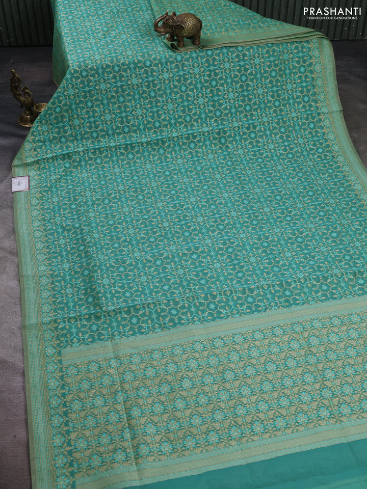 Banarasi cotton saree teal green with allover thread weaves and woven border