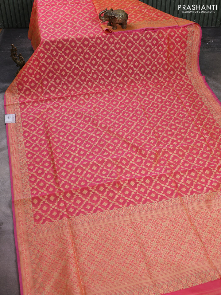 Banarasi cotton saree dual shade of pinkish orange with allover thread weaves and woven border