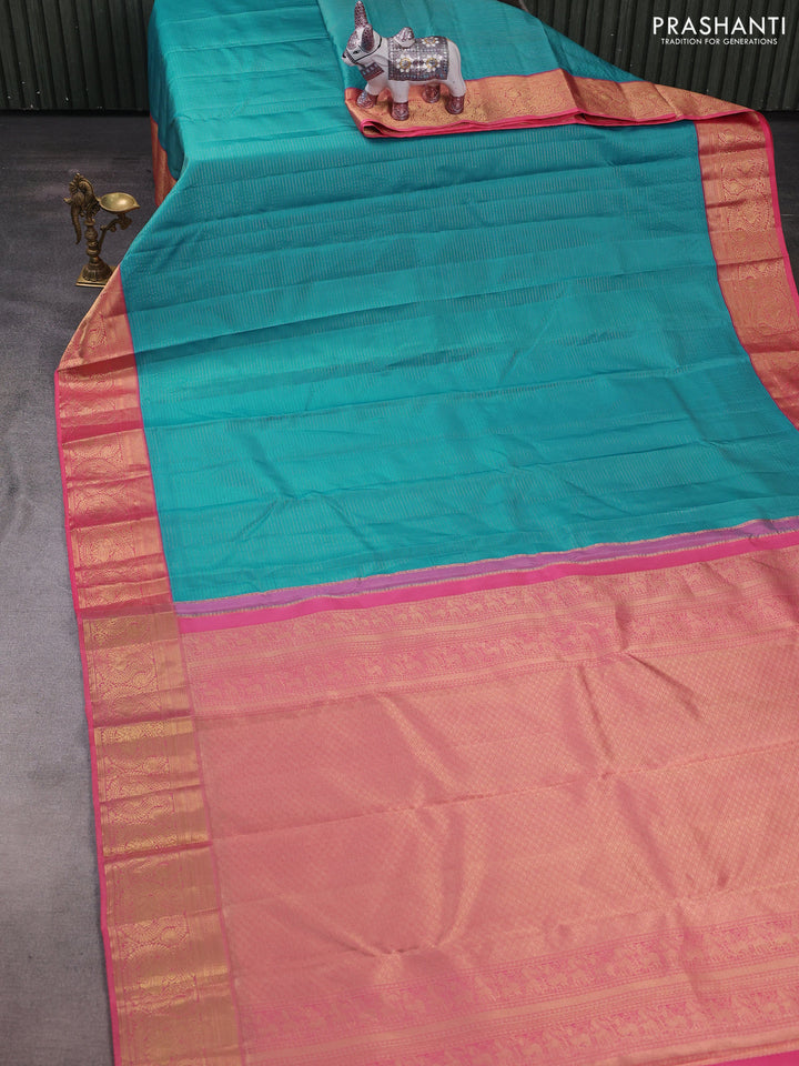 Pure kanchipuram silk saree teal blue and peach pink with allover zari stripe pattern and rich zari woven border