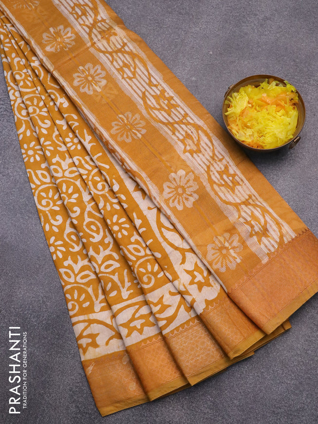 Semi gadwal saree mustard shade with allover butta prints and zari woven border