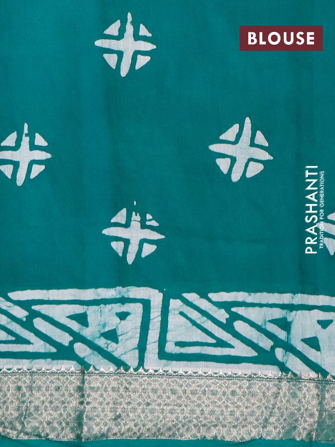 Semi gadwal saree peacock green and off white with allover batik prints and zari woven border