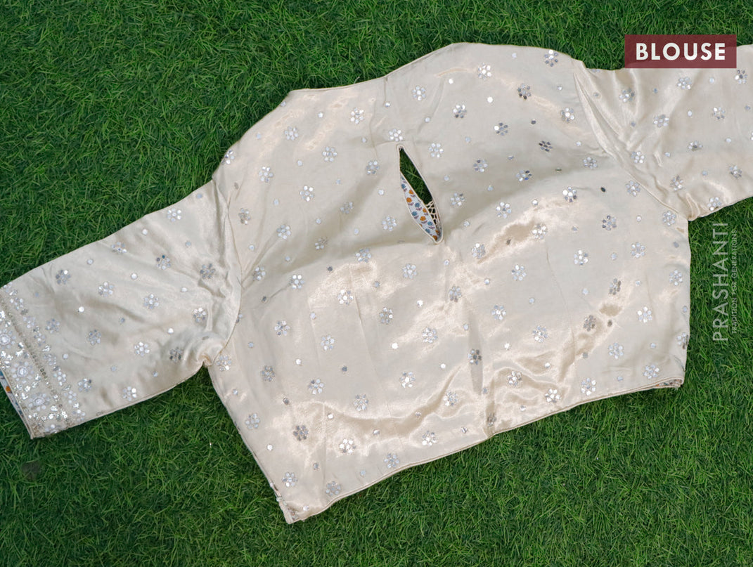 Organza silk saree cream with allover zari woven stripes pattern & mirror work and gottapatti lace work border & embroidery work readymade blouse