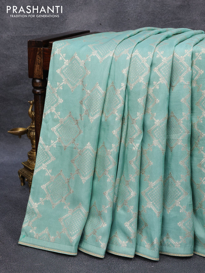 Tussar silk saree pastel green with allover zari woven geometric weaves and lace work border & embroidery work readymade blouse