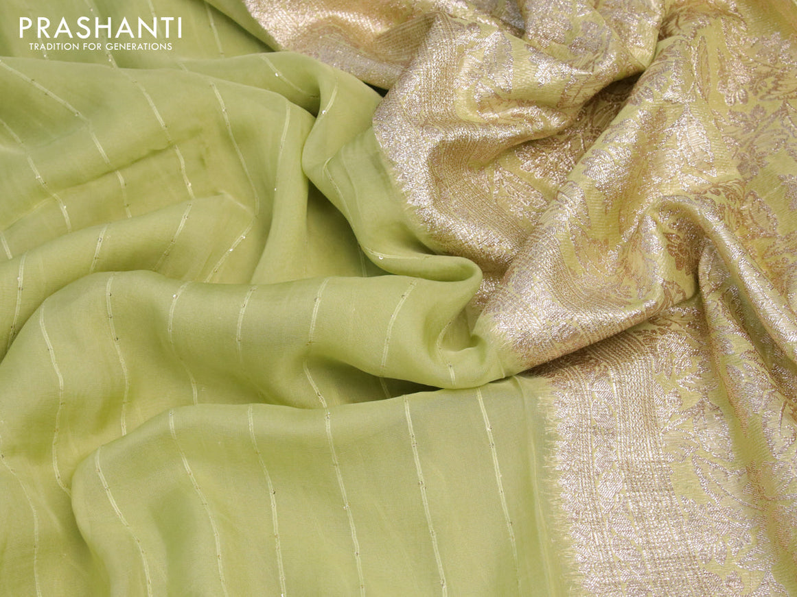 Chinon silk saree pista green with allover sequin work and zari woven floral border & zari butta blouse