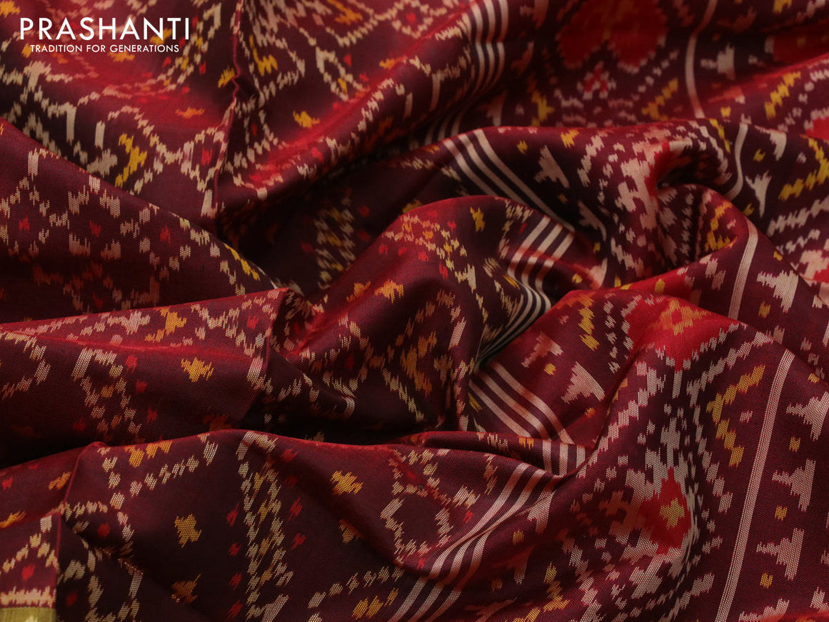 Rajkot patola silk saree deep maroon with allover ikat weaves and zari woven ikat style border