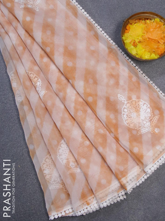Semi orangza saree off white and rust shade with allover ikat prints & embroidery buttas and crocia lace border - {{ collection.title }} by Prashanti Sarees