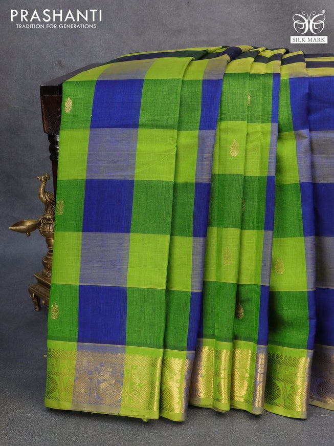 Blue Nine-Yard Cotton Saree Detailed with Buttas Enclosed Checked All Over Its Body, Complemented by a Contrast Border of Floral, Geometric, and Paisley Designs, Subtly Striped Pallu, and Comes Without a Blouse main image 0