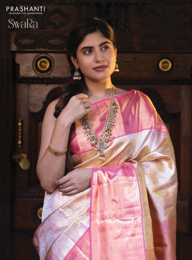 Pure kanjivaram tissue silk saree cream and light pink with allover zari woven brocade weaves and zari woven border