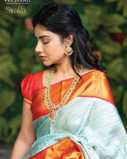 Pure kanjivaram silk saree light blue and red with allover silver zari woven brocade weaves and golden zari woven border