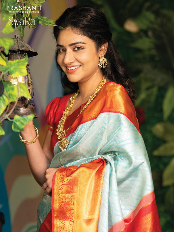Pure kanjivaram silk saree light blue and red with allover silver zari woven brocade weaves and golden zari woven border