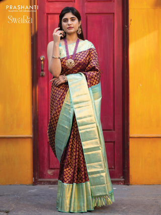 Pure kanjivaram silk saree deep purple and teal blue shade with allover annam zari woven butta weaves and rich zari woven border
