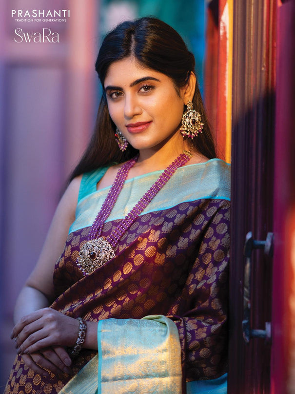 Pure kanjivaram silk saree deep purple and teal blue shade with allover annam zari woven butta weaves and rich zari woven border