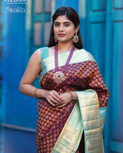 Pure kanjivaram silk saree deep purple and teal blue shade with allover annam zari woven butta weaves and rich zari woven border