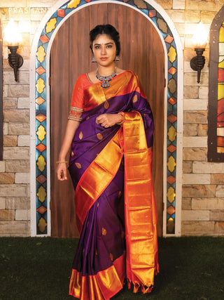 Pure kanjivaram silk saree dark blue and dual shade of pinkish orange with allover self emboss & zari buttas and rich zari woven border