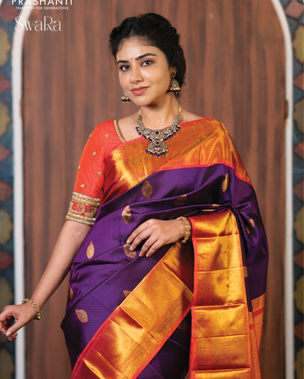 Pure kanjivaram silk saree dark blue and dual shade of pinkish orange with allover self emboss & zari buttas and rich zari woven border