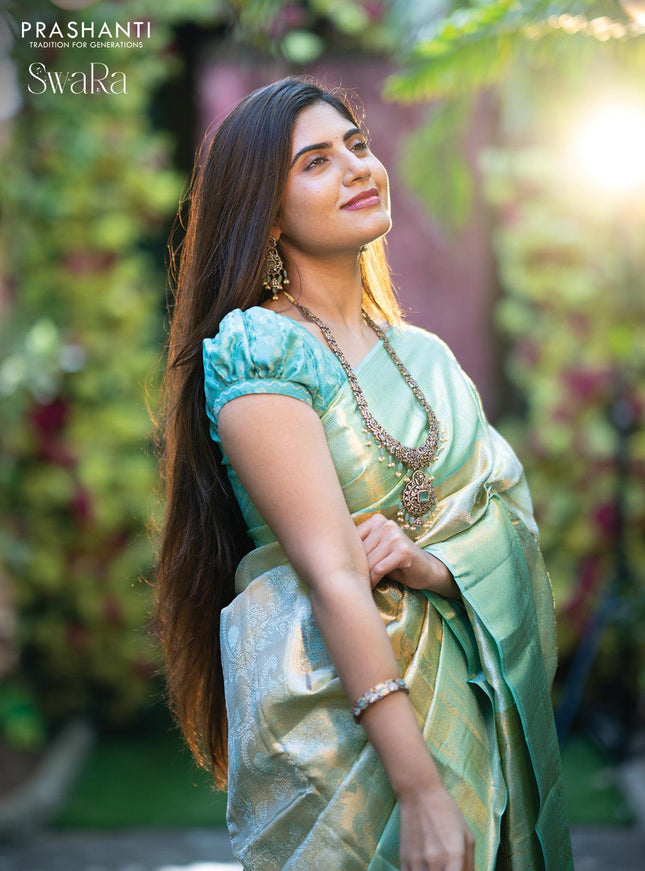 Pure kanjivaram tissue silk saree cream and teal blue with allover zari woven brocade weaves and zari woven border