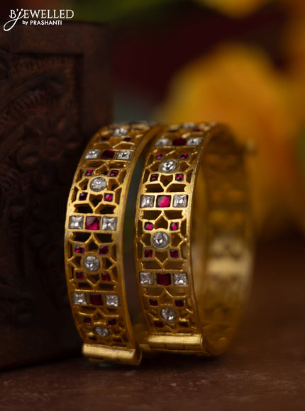 Jadau screw type bangles with pink jadau kundan stones