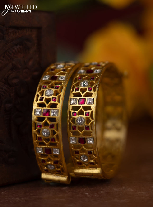 Jadau screw type bangles with pink jadau kundan stones