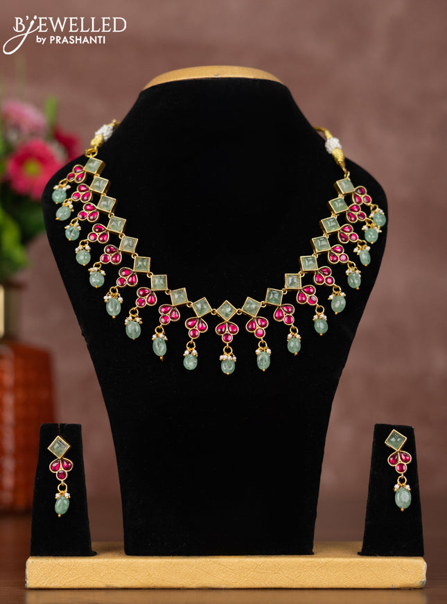 Jadau necklace with pink jadau & mint green stones and beads hangings