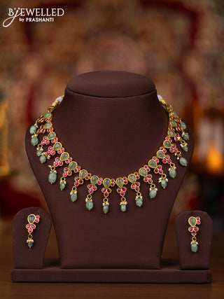 Jadau necklace with pink jadau & mint green stones and beads hangings