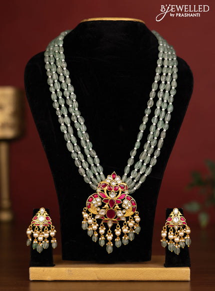 Beaded multilayer green haaram peacock design with pink jadau kundan stones and natural beads & pearl hangings