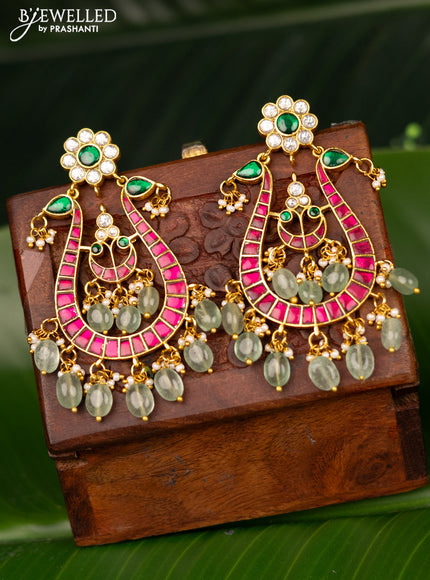 Antique screw type earrings peacock design with jadau kundan stones and pearl hangings