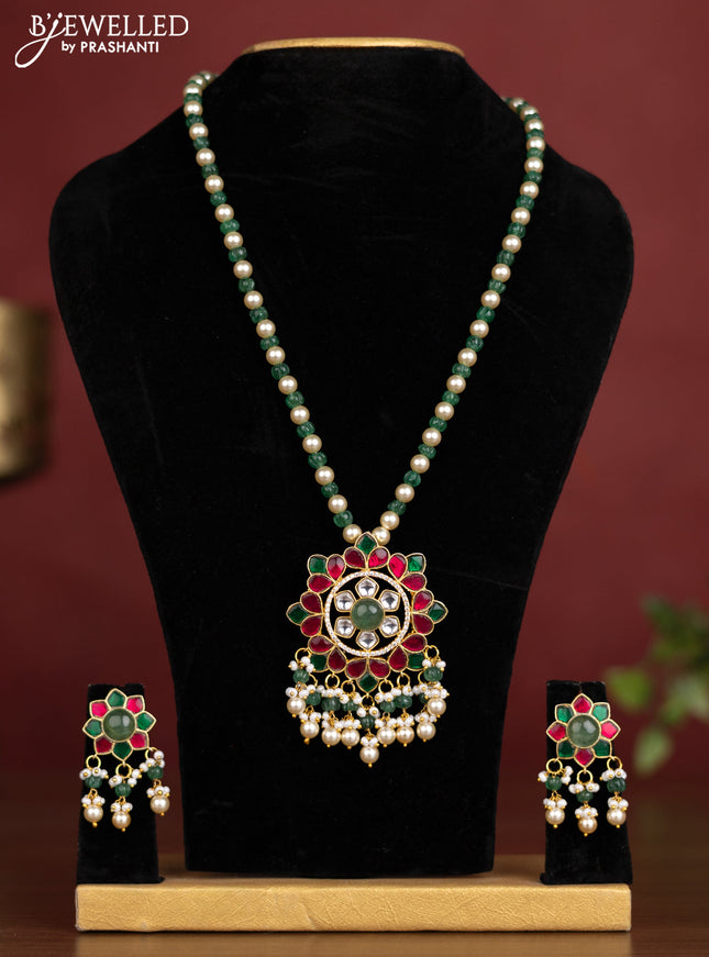 Antique beaded green and pearl necklace with a floral pendant, jadau kundan stones, and pearl & bead hangings