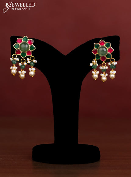 Antique beaded green and pearl necklace with a floral pendant, jadau kundan stones, and pearl & bead hangings