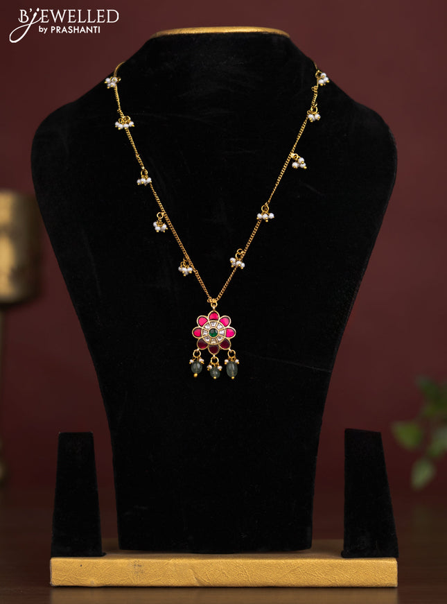 Antique chain with a floral pendant, jadau kundan stones, and pearl & bead hangings