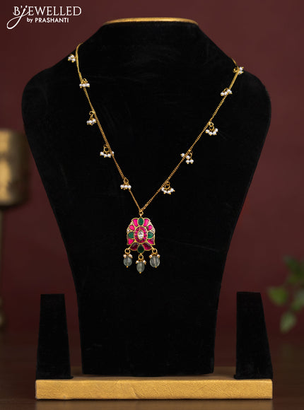 Antique chain with a floral pendant, jadau kundan stones, and pearl & bead hangings