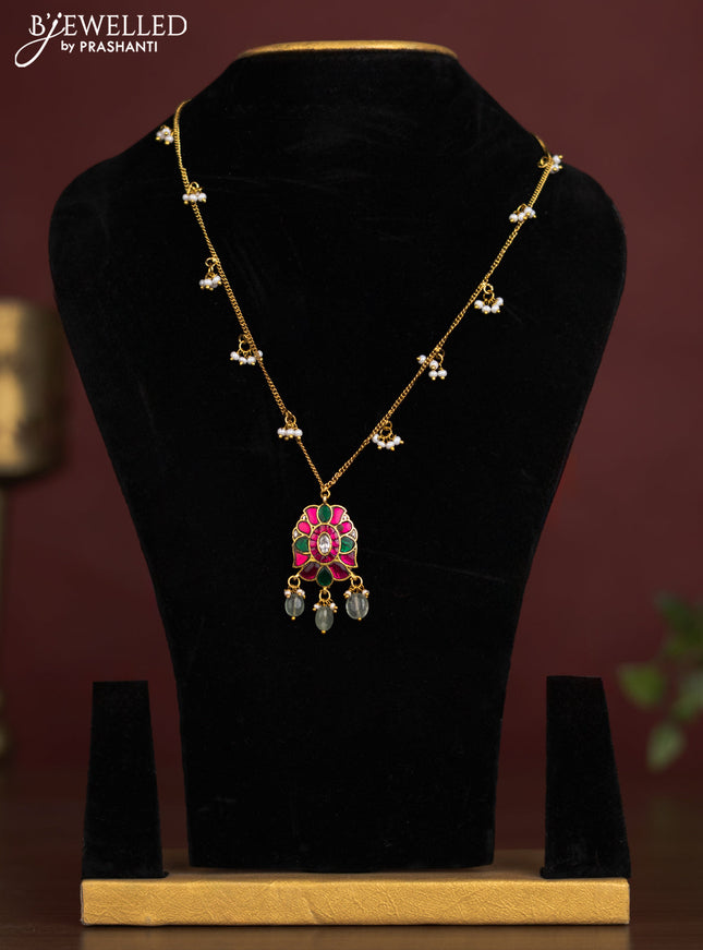 Antique chain with a floral pendant, jadau kundan stones, and pearl & bead hangings